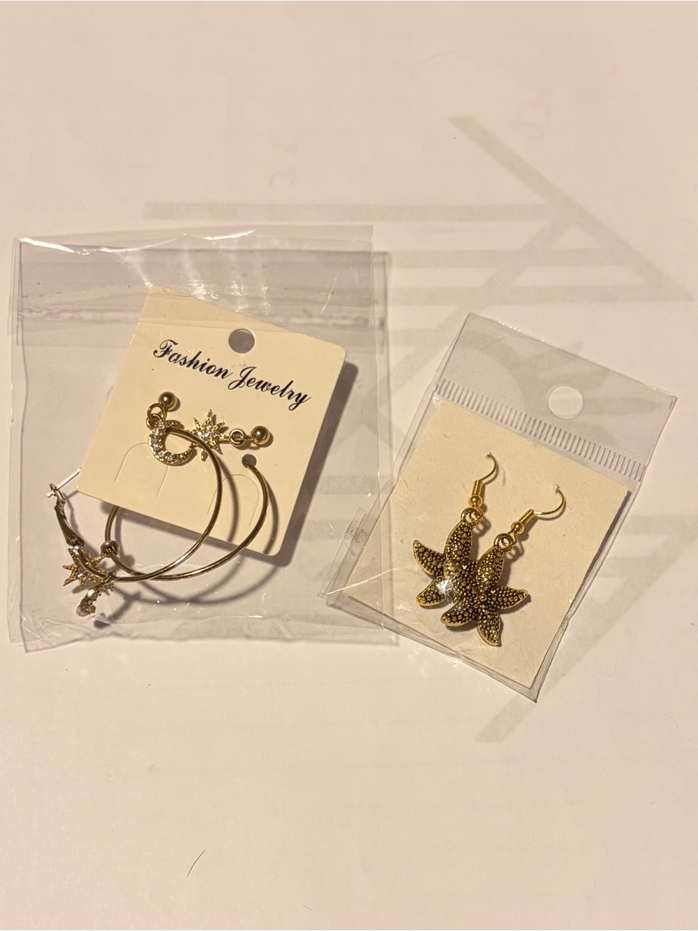 Two pairs of gold tone earrings